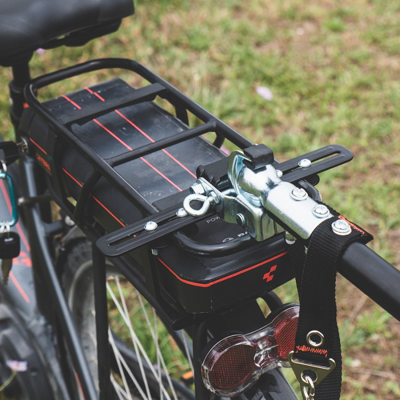 Adapter for bicycle trailer attachment to luggage carrier
